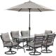 Hanover Lavallette 7-pc Steel Outdoor Dining Set with Silver Linings Cushions, Swivel Rockers, Table, Umbrella and Base