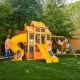 KidKraft DIY Atlas Point Wooden Outdoor Playground Set with Slides, Rock Wall, Cafe, Play Kitchen, Swing Set, and Accessories